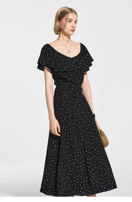 A long skirt with a single neckline and ruffled edges, dotted with floral patterns