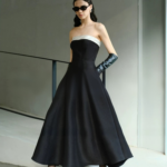 Elegant strapless, waist cinched, big black dress