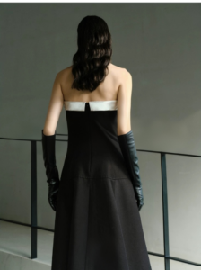 Elegant strapless, waist cinched, big black dress
