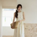 Printed round neck sleeveless lace up cream yellow dress