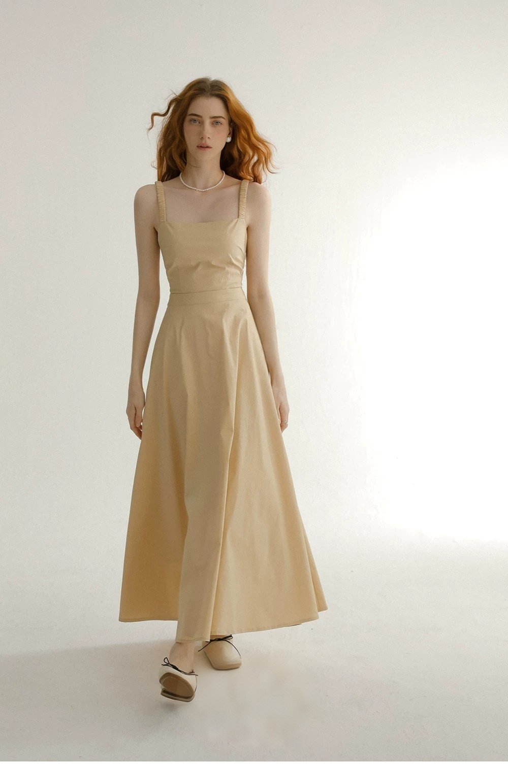 Wearing a camisole dress with a backless mini skirt and a French dress Wearing a camisole dress with a backless mini skirt and a French dress