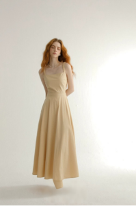 Wearing a camisole dress with a backless mini skirt and a French dress