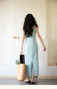 Sleeveless waist cinched dress with hollowed out printed suspender mid length skirt