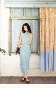 Sleeveless waist cinched dress with hollowed out printed suspender mid length skirt