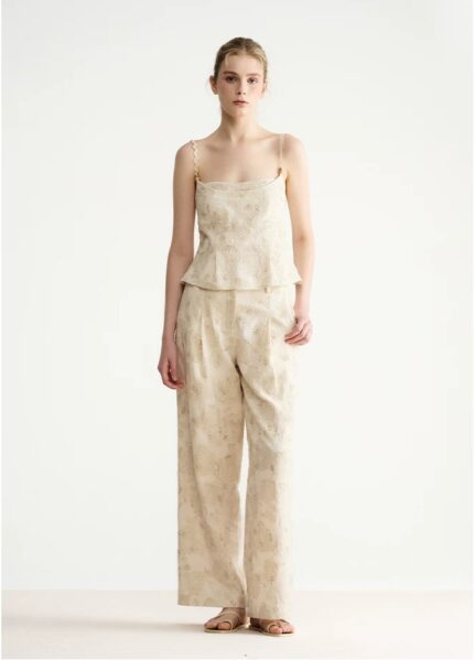 Embroidered asymmetrical top with wavy shoulder straps and beaded fake two-piece straps