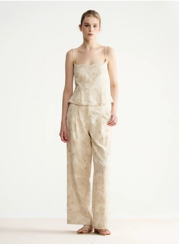 Embroidered asymmetrical top with wavy shoulder straps and beaded fake two-piece straps